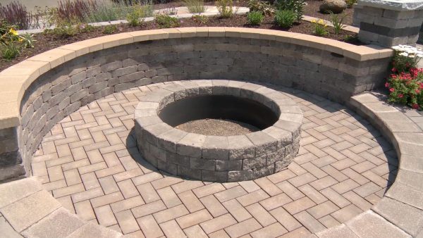 Hardscaping creating a firepit by Dunning tone & Supply